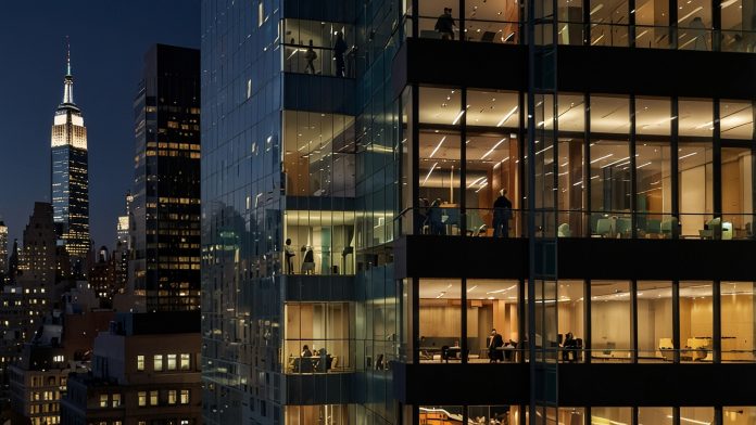 A striking view of the 599 Lexington Avenue skyscraper in Midtown Manhattan, showcasing its sleek glass facade and modern architecture, illuminated against the evening New York City skyline.