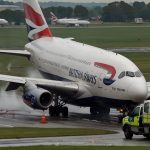A British Airways Airbus A380, Flight BA286, lands at London Heathrow with emergency vehicles on standby after a medical emergency on May 26, 2025.