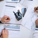 Business planning charts reviewed at a meeting