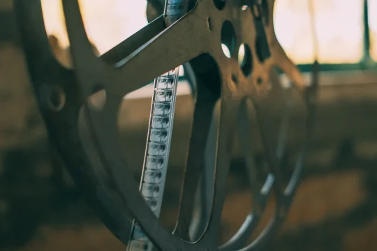 Vintage 35mm film reel with an exposed strip of film, illustrating a feature on influential short films